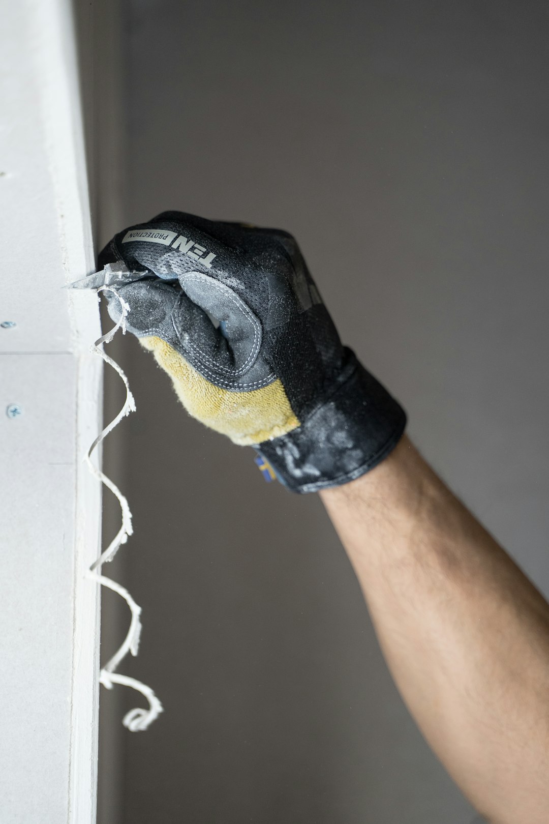 gallery-5 A carpenter with a work glove cutting in Sweden.